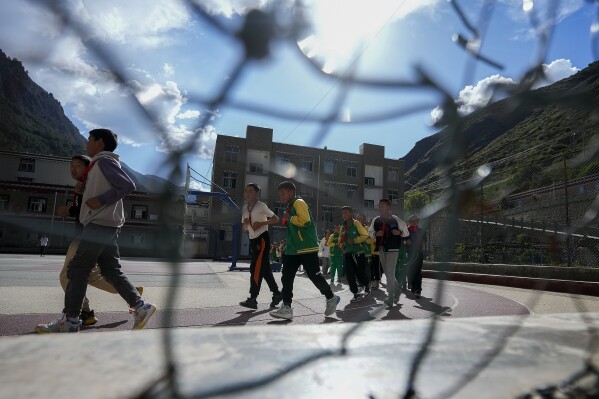 China shows off a Tibetan boarding school that’s part of a system some see as forced assimilation